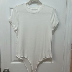 A new day short sleeve white bodysuit. Size XL.